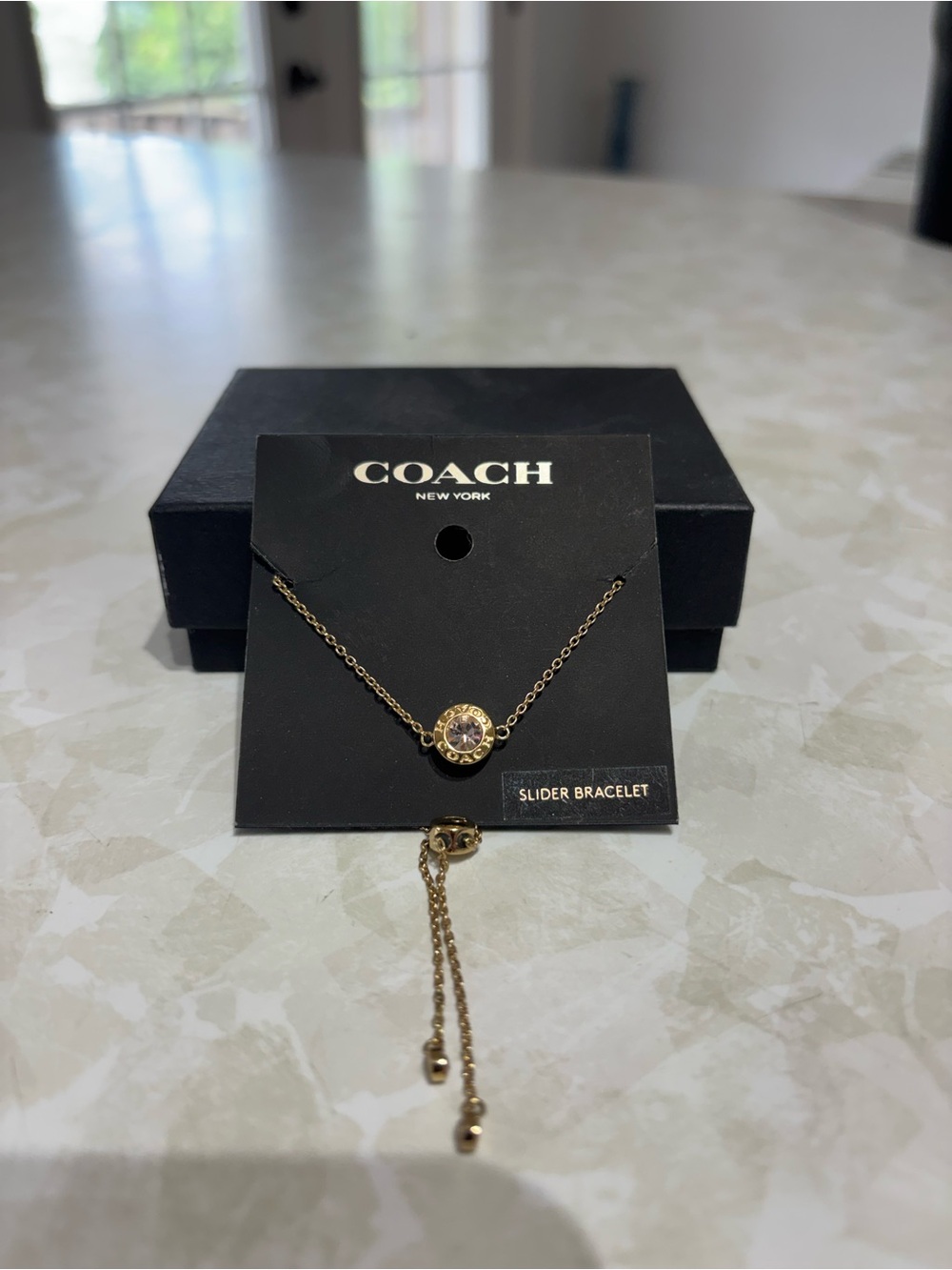 COACH Gold Crystal Slider Bracelet with Clear Stone